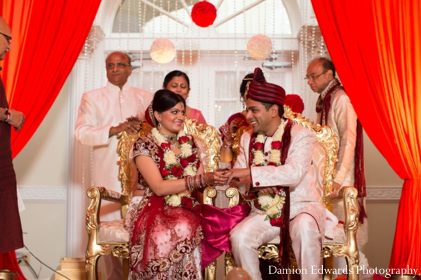 bride,and,groom,at,wedding,ceremony,ceremony,Damion,Edwards,Photography,indian,bride,and,groom,jai,mala,traditional,customs,and,rituals,at,the,indian,wedding,traditional,indian,wedding,ceremony