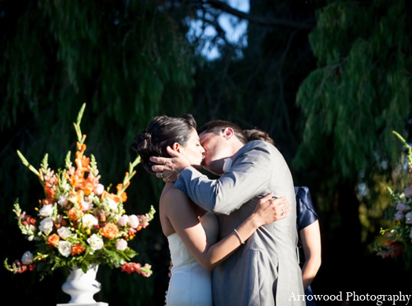 indian wedding outdoor floral kiss