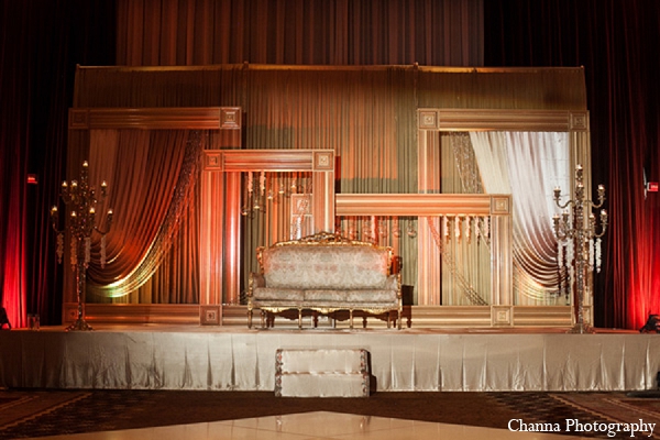 indian wedding reception stage gold loveseat