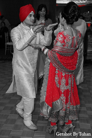 An Indian bride and groom celebrate their pre-wedding festivities before their traditional Sikh ceremony. They then have a quick portrait session with the bridal party and head of to the reception.