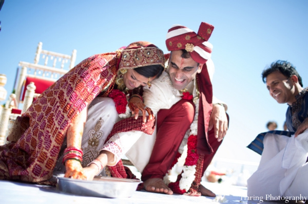 The bride and groom perform traditional customs and rituals at their Indian wedding ceremony.