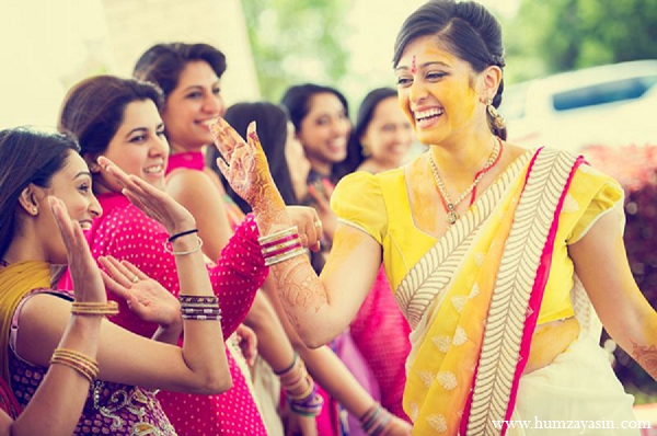 indian wedding bride pithi ceremony bridal party yellow sari