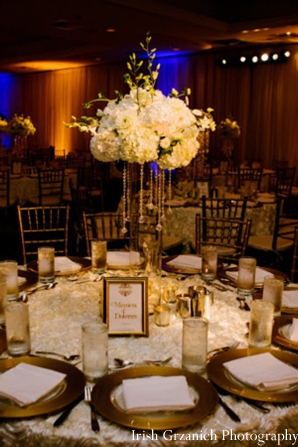 indian wedding reception table setting floral arrangement