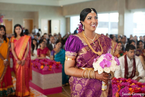 indian wedding bride walks down aisle