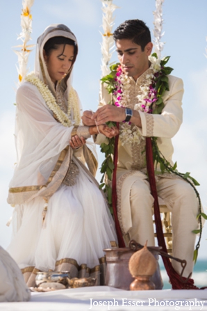 indian wedding bride groom tying bangle