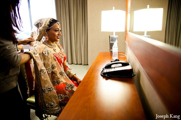 indian wedding bride outfit red lengha getting ready