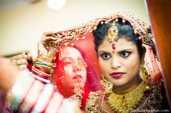 indian-wedding-bride-getting-dressed-for-ceremony