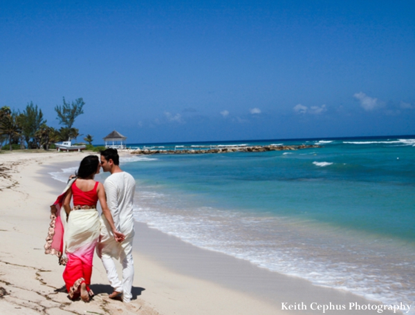 indian-wedding-groom-portrait-bride-walking-beach