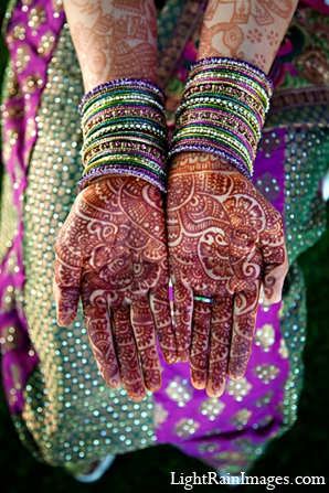 This bride and groom enjoy there wedding festivities in Phoenix, AZ. They choose various bold color palettes for their mehndi, puja, sangeet, ceremony, and reception.