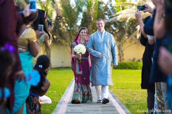 indian wedding bride walks down aisle