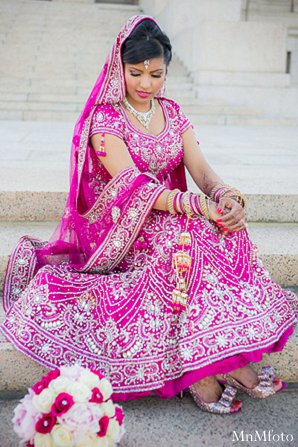 indian wedding bride lengha pink bouquet