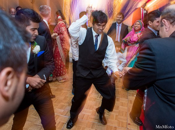 indian wedding reception guests dancing dj