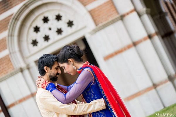 indian wedding bride and groom outside hugging portrait