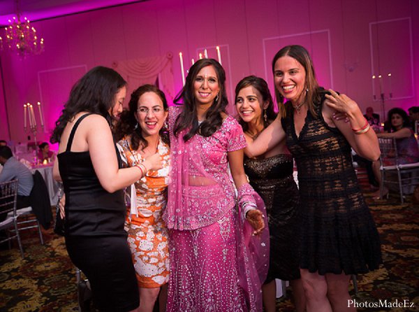 This Indian bride and groom choose to celebrate their wedding under a beautiful mandap before dancing at their reception.