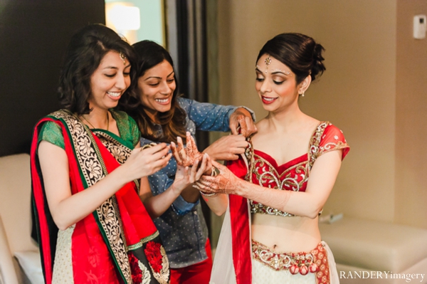 indian wedding bride getting dressed traditional