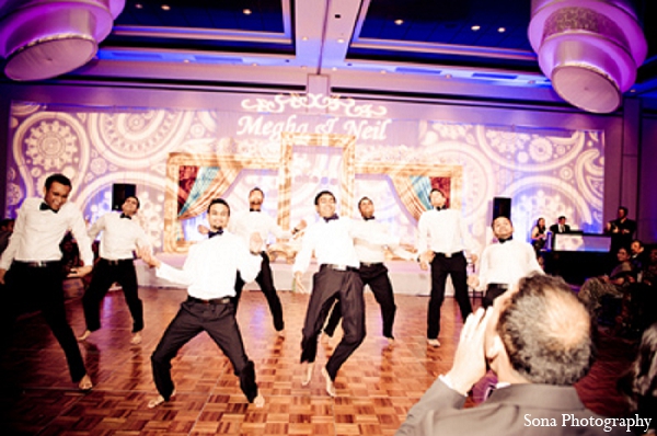 indian wedding reception performance groomsmen lighting