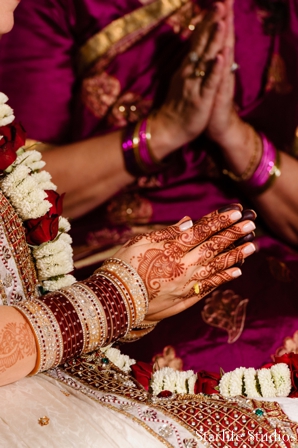 indian wedding ceremony praying henna