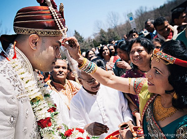 This Indian wedding features a colorful sangeet, a cheerful baraat, gorgeous bridal fashions, and a breathtaking reception!