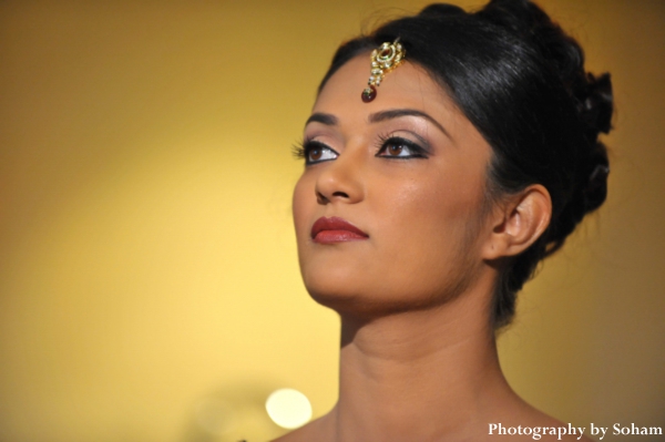 indian-wedding-bride-getting-ready-makeup-tikka-gold