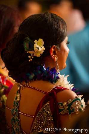 Indian bridal hairstyles with flowers for a peacock theme indian wedding.
