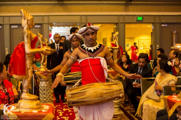 Performers attend this indian wedding ceremony.