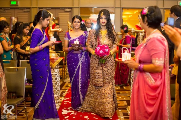 An Indian bride wears a traditional sari at her Hindu Indian wedding.