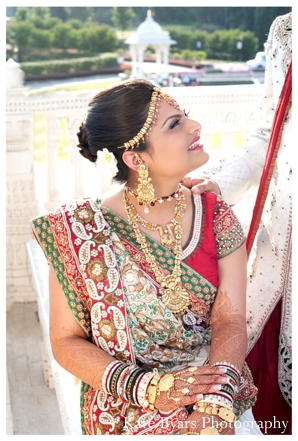 an indian bride in her traditional bridal lengha and indian bridal jewelry.