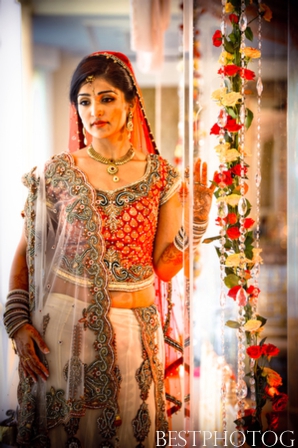 An Indian bride wears a traditional bridal lengha.