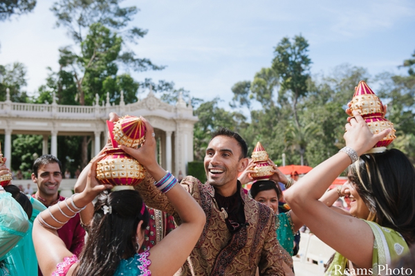 Indian wedding begins with bridesmaids holding coconuts.