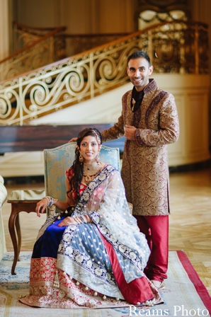 Indian bride and groom pose for portrait before indian wedding ceremony.