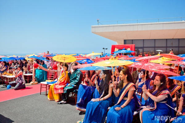 Outdoor indian wedding ceremony in blue saris.