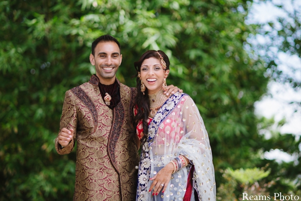 Indian wedding photography captures candid between indian bride and groom.