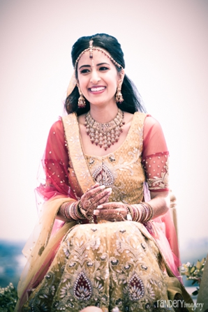 indian bride in traditional wedding lehenga.