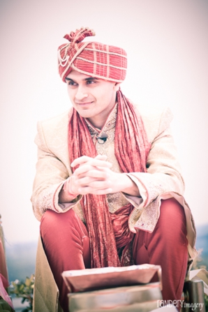 groom at indian wedding in traditional indian wedding outfit.