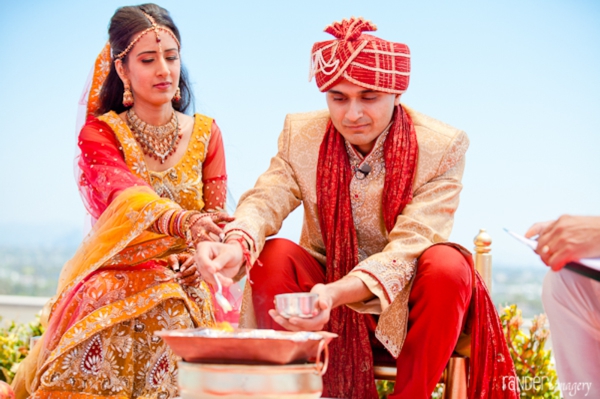 Indian bride and groom in traditional indian wedding outfits.