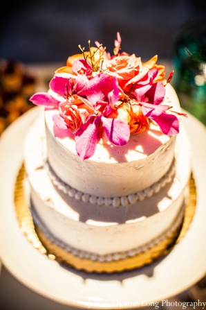 indian wedding cake with fresh flowers.