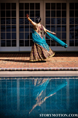 Indian bride wears a blue and plum indian wedding lengha.