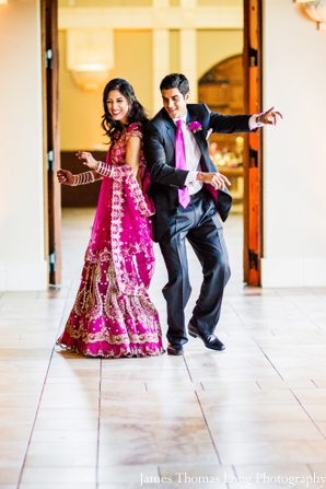 indian bride and groom enter indian wedding reception.