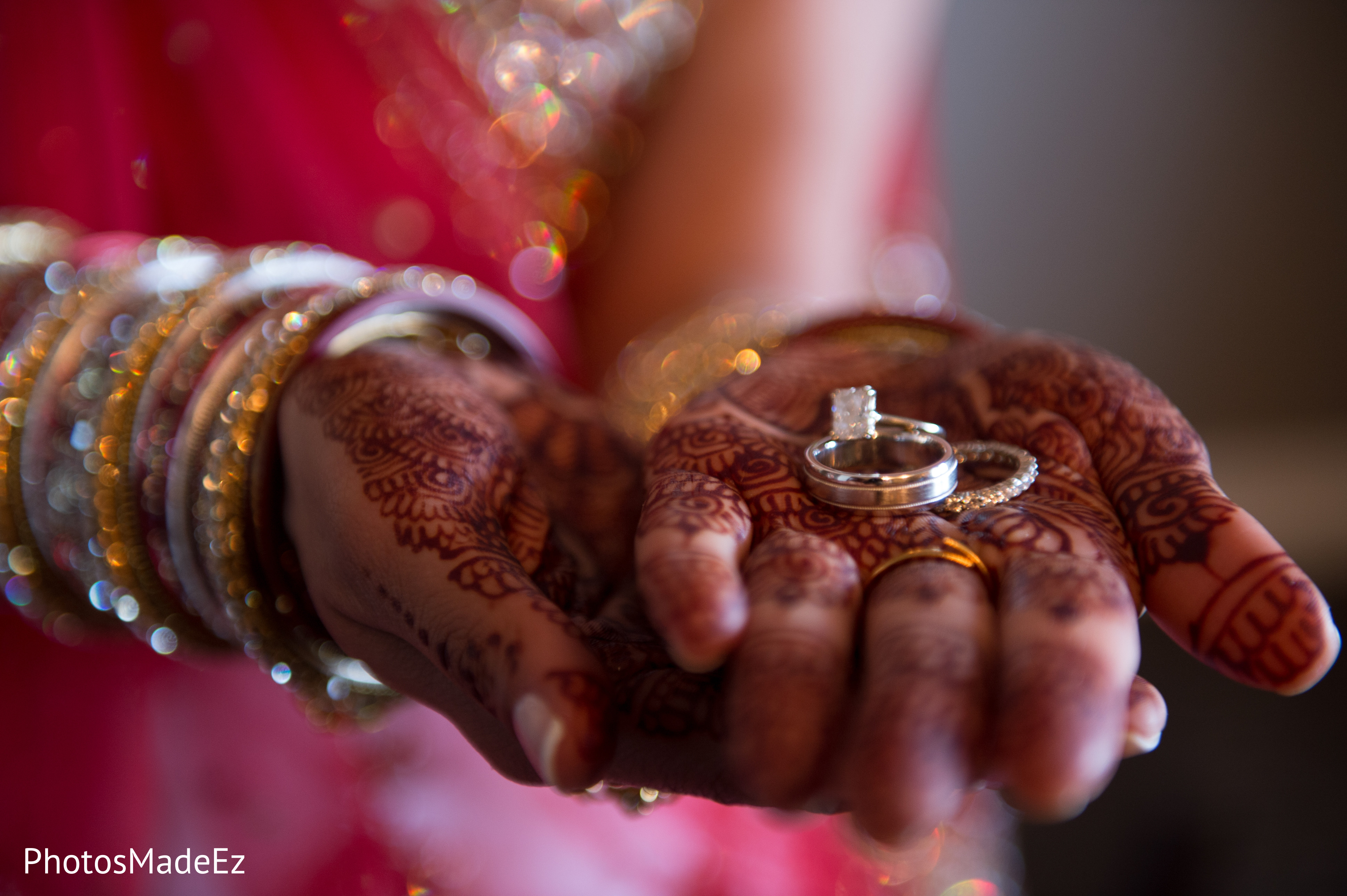 Image of Photo of the couple posing and holding each other's fingers and  showing rings during the typical Indian engagement ceremony.-ED092110-Picxy