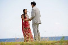 A bride and groom take portraits after their wedding ceremony in the Caribbean.