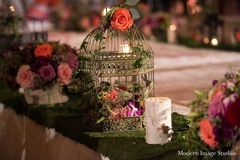 For their magical, romantic reception, this Indian bride and groom opt for enchanting floral and decor and a gorgeous five-tier cake!