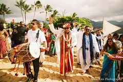 An Indian bride and groom wed on a beach in Hawaii.