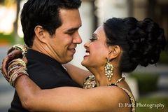 For their beautiful Indian wedding reception, this bride and groom switch into fabulous new outfits and slice into their gorgeous cake!