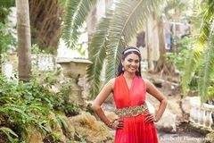 An Indian bride and groom dress in formal wear for portraits before their pre-wedding festivities.