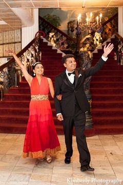 An Indian bride and groom gather friends and family to have a formal pre-wedding celebration.