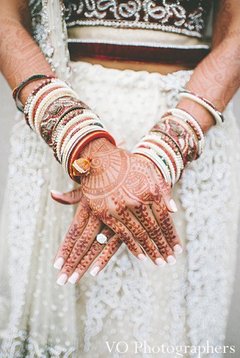 This beautiful Indian bride prepares for her fabulous wedding ceremony by getting her hair and makeup done!