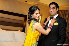 An Indian bride and groom pose for pictures during their wedding celebrations in Las Vegas.