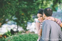 After their beautiful Indian wedding ceremony, this bride and groom take a moment to pose for lovely portraits.