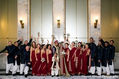 A bride poses with her bridal party.