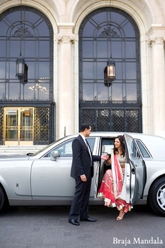 An Indian bride and groom take some portraits before their reception.